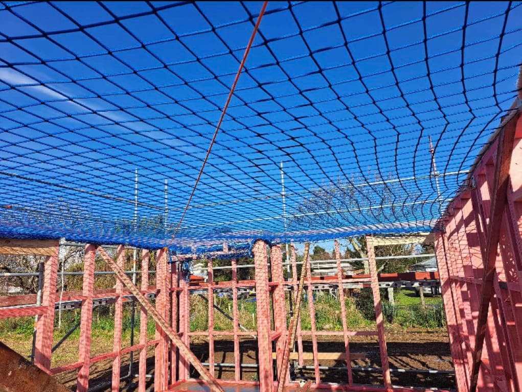 Construction safety net rigged above a residential build in Wellington