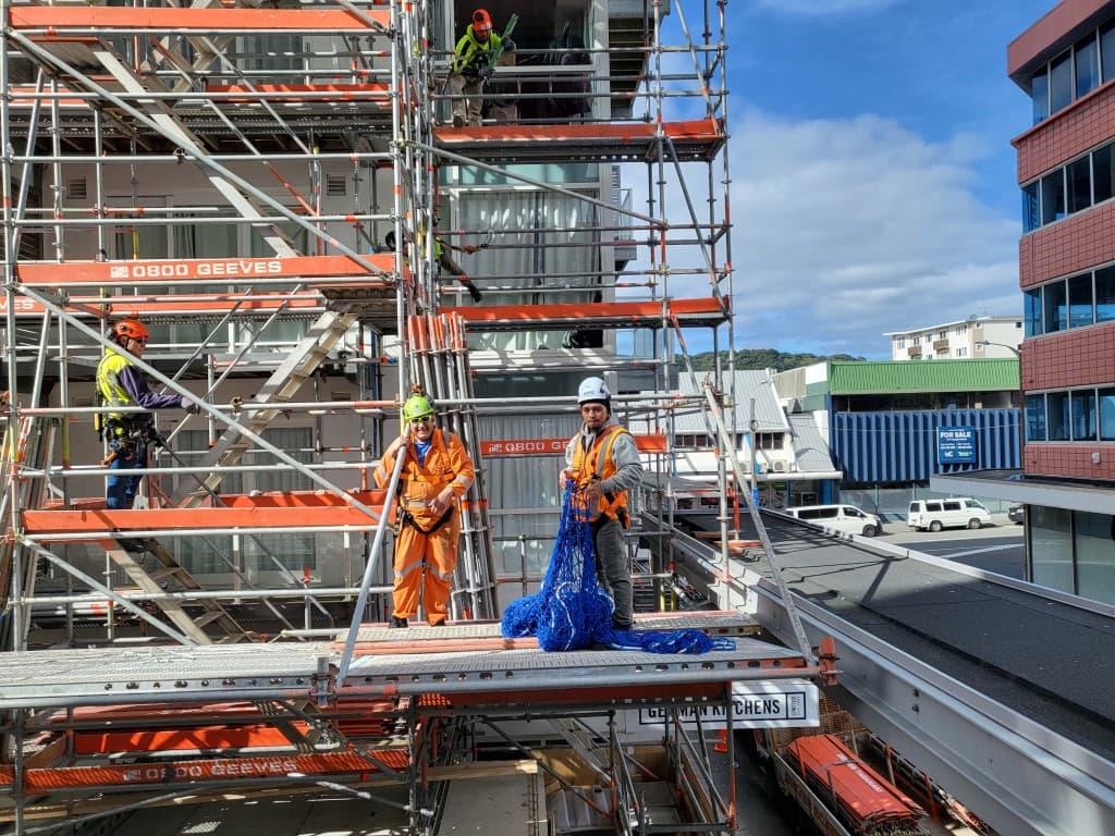 Aotea Solutions riggers installing safety nets on a Wellington construction site